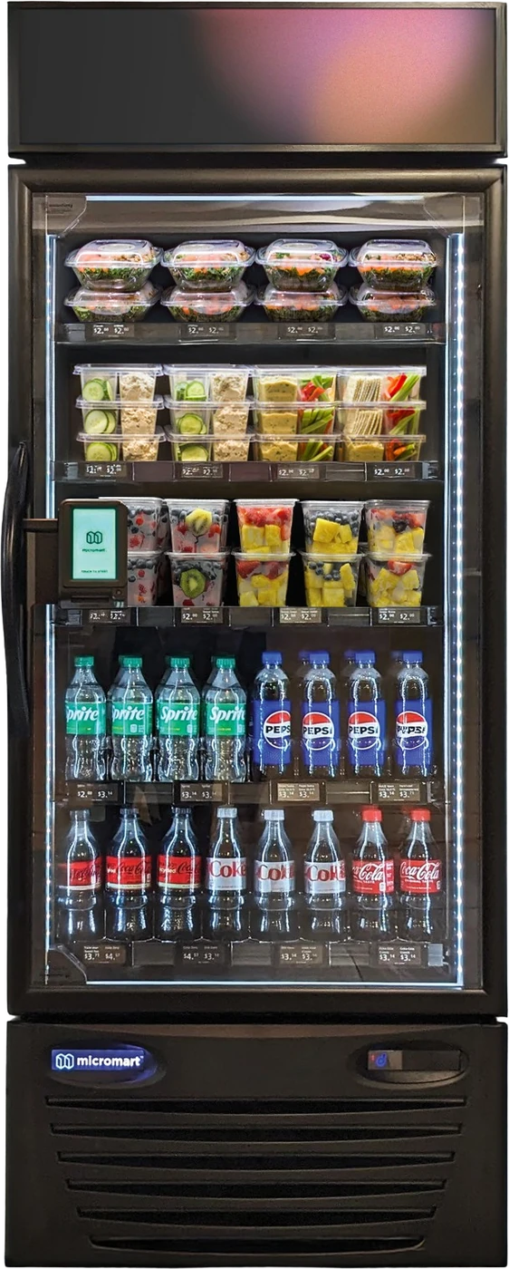 Micromart AI smart fridge stocked with fresh salads, fruit and cold drinks